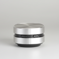 Silver portable speaker on a white background