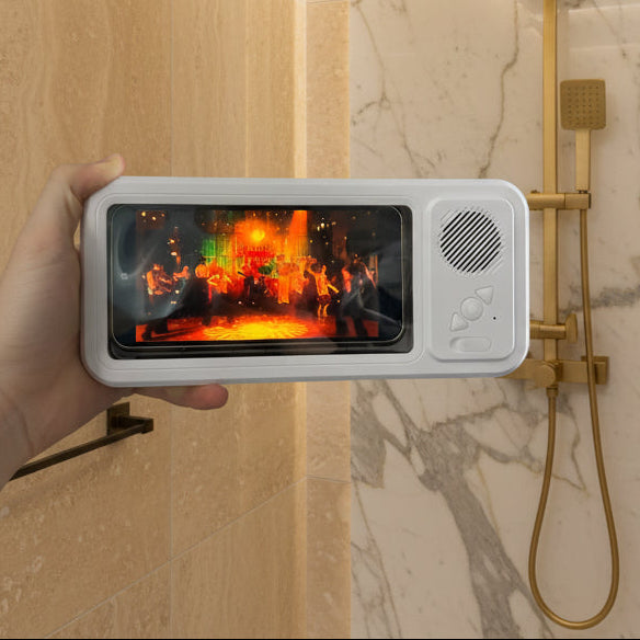 Small electronic device with a screen displaying a colorful scene, held in front of a shower.